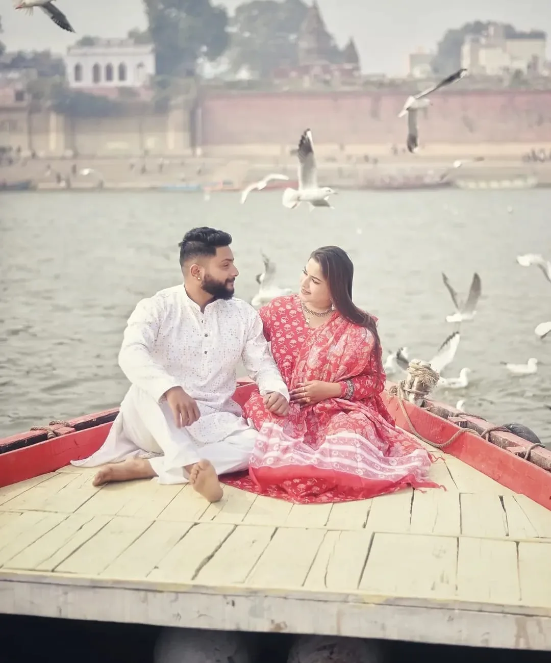 A couple sharing a quiet moment beside the Ganga in Varanasi